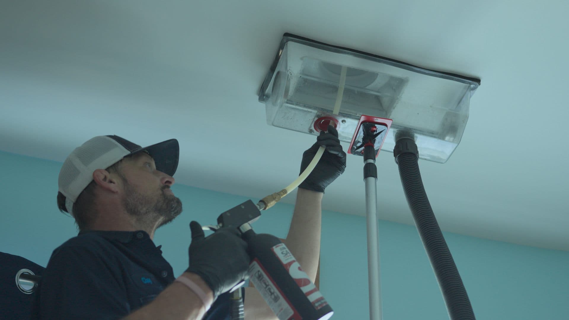Restorify technician treating a ceiling vent to remove odor at the source
