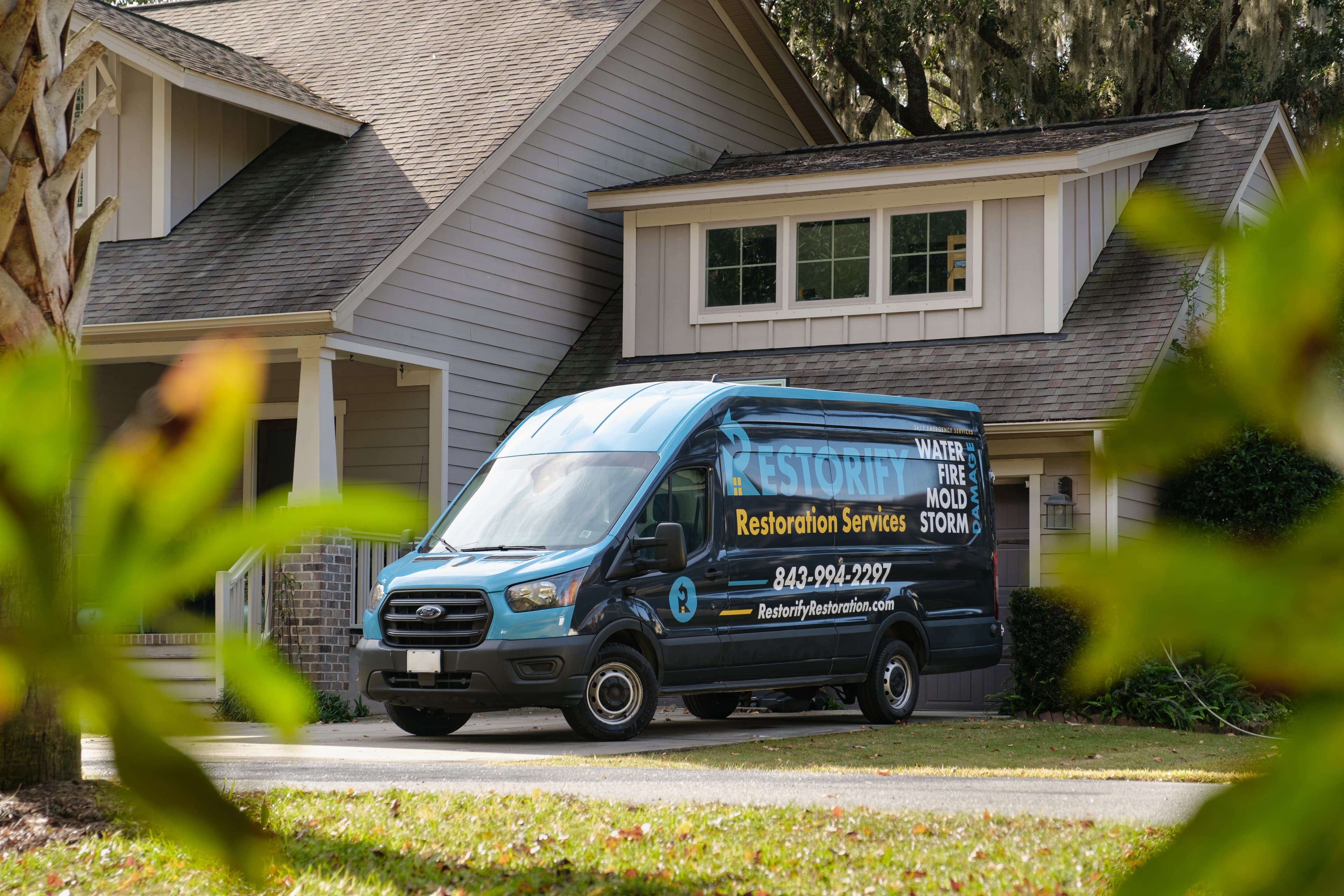 Restorify Restoration branded service van in the Charleston Lowcountry