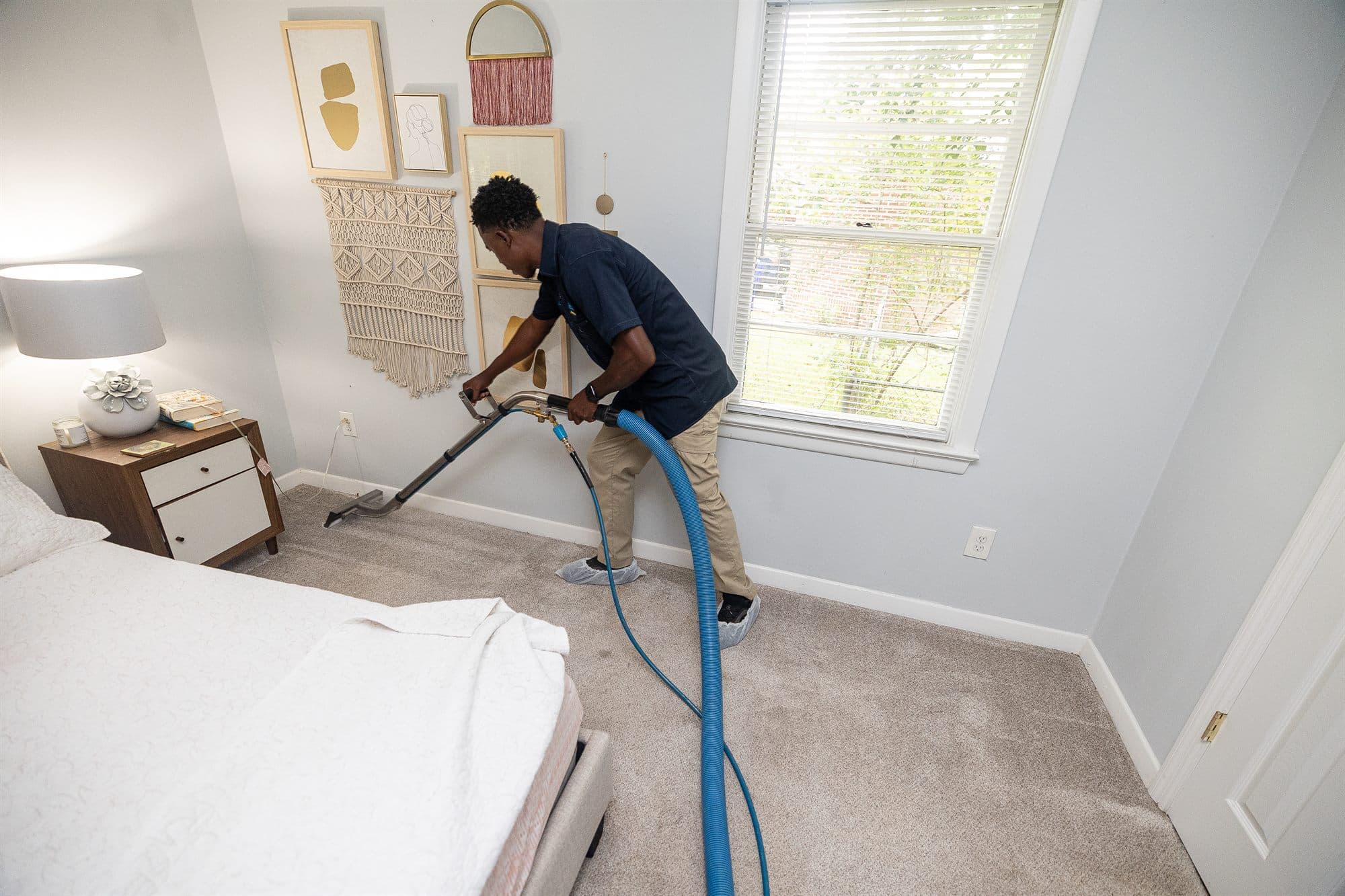 Restorify technician deep-cleaning carpet in a Charleston home