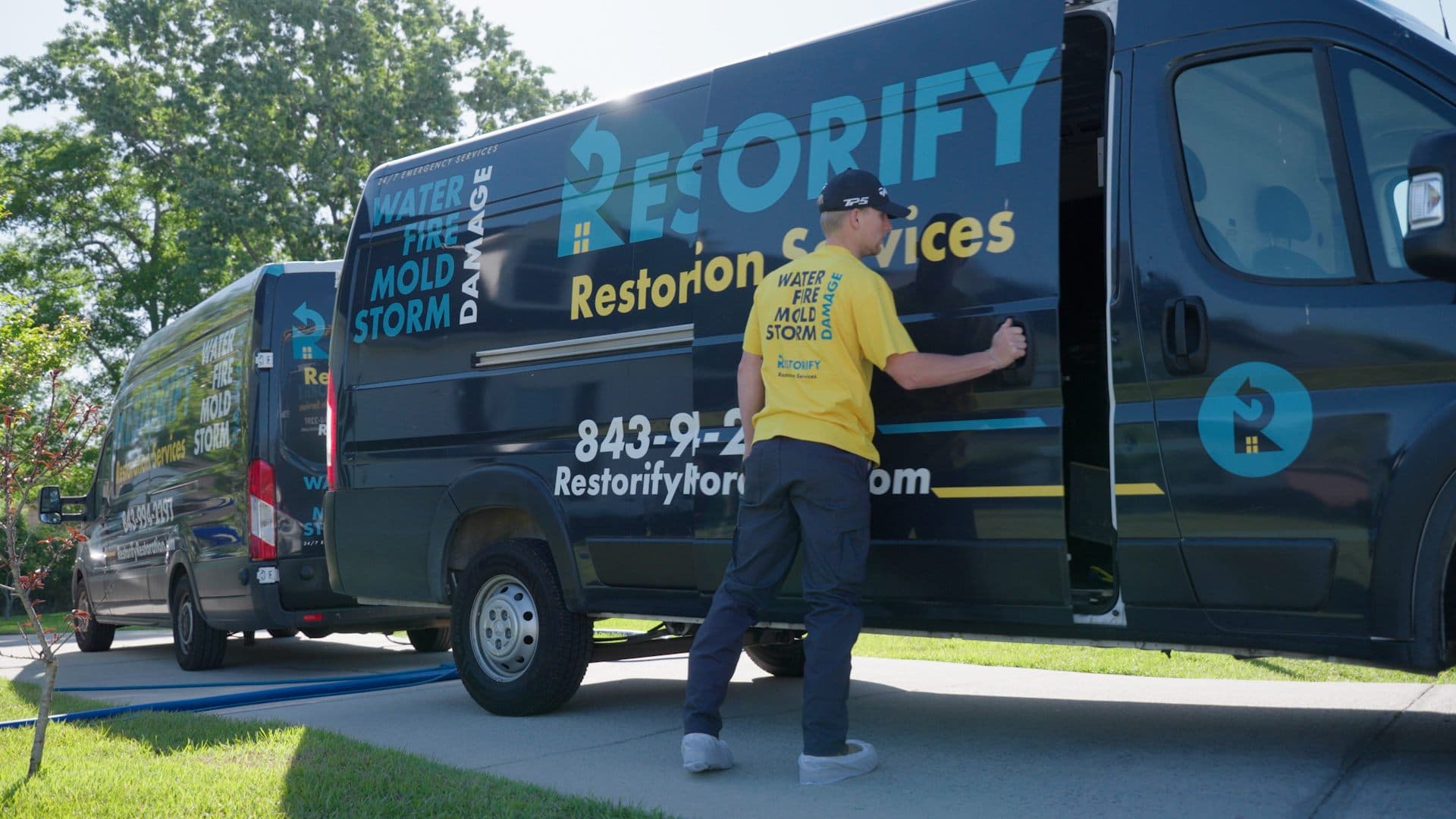 Restorify technician heading to the branded company vans